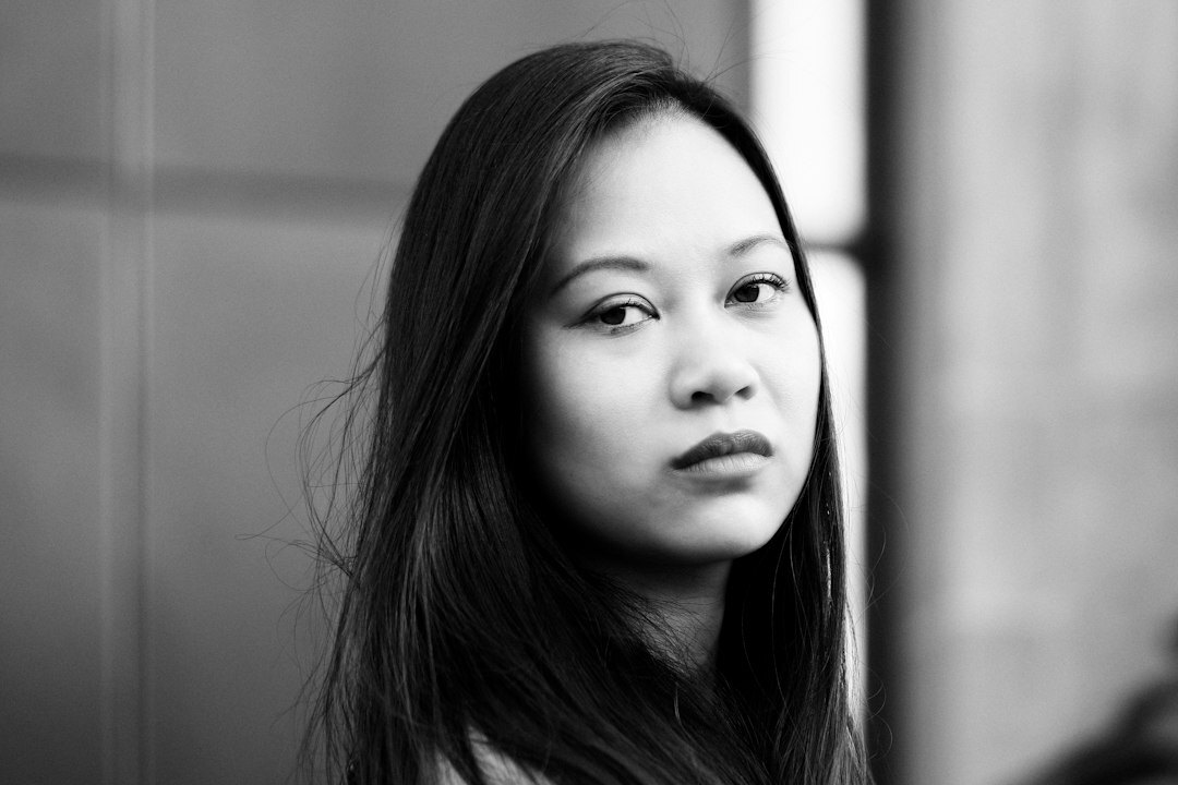 Studio portrait of a Singaporean Chinese woman in professional business attire