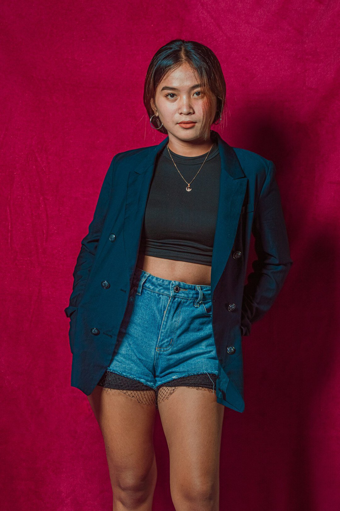 Studio portrait of a Filipino man in a blazer